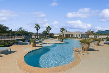 Resort-inspired swimming pool with tanning deck